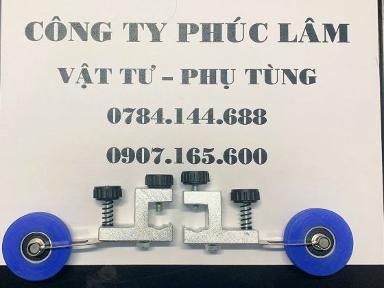 Bánh xe đè giấy máy sau in